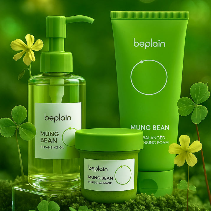 This luxurious Korean Mung Bean Complete Cleansing Set is displayed in a vibrant, nature-inspired scene that highlights its clean-beauty purity and premium botanical origins. The radiant Mung Bean Cleansing Oil stands on the left with a golden-green glow, while the pH-balanced Mung Bean Cleansing Foam rises tall beside it, embodying advanced Korean deep-cleansing innovation. In front, the rich Mung Bean Pore Clay Mask showcases its detoxifying green texture. Modern Korean Skincare, acne fighter.